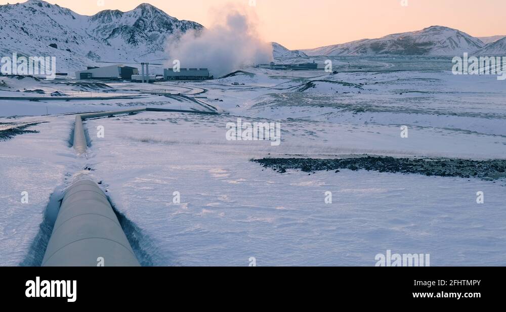 Geothermal power plant at Hellisheidi volcanic area, pipes in frozen ...