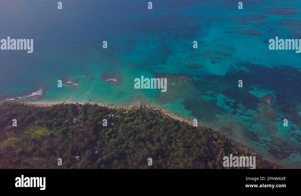 Drone shot above the beaches and coral reefs of Little Corn Island