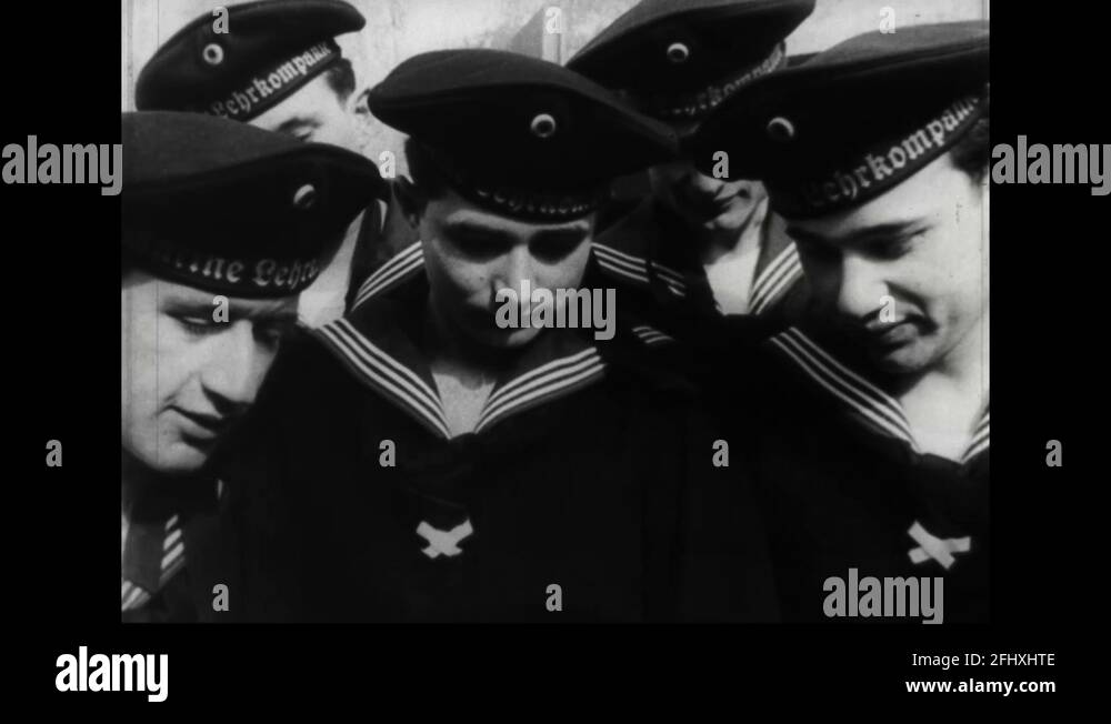 Men Look At A Sample Ship While A Tugboat Pulls A Huge Ship 1955