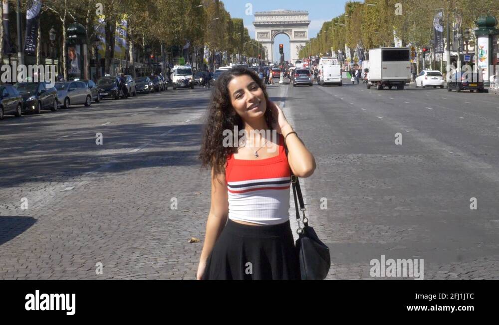 Model in Paris flirting with the camera in slow-motion at Champs ...