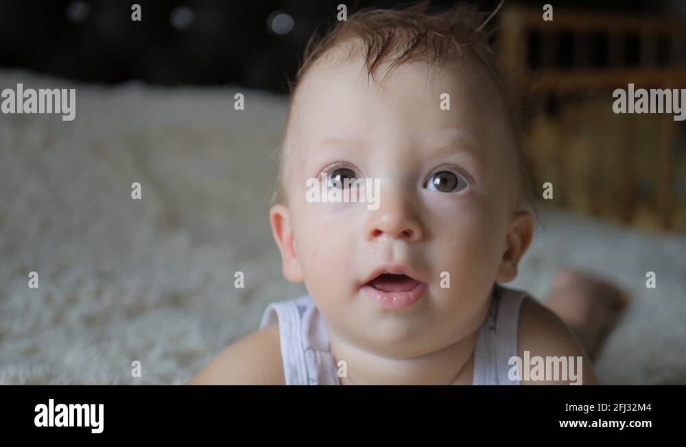 adorable-little-happy-laughing-1-year-old-baby-boy-is-looking-to-camera