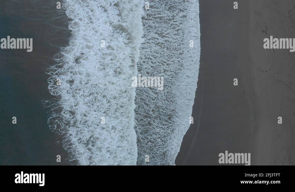 Areal view of breaking waves at beach in Seminyak, Bali Stock Video