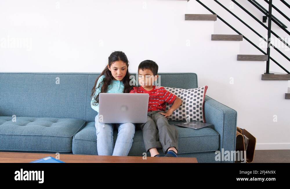 Brother sister on sofa using Stock Videos & Footage - HD and 4K Video ...