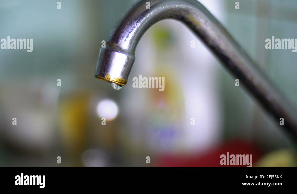Water flows from a Tap into a Sink. Slow Motion Stock Video Footage Alamy
