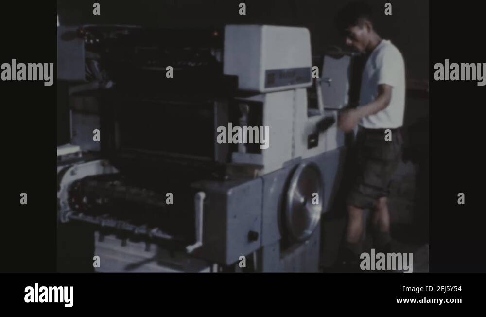 Korean soldier operates offset printing presses 1968 Stock Video