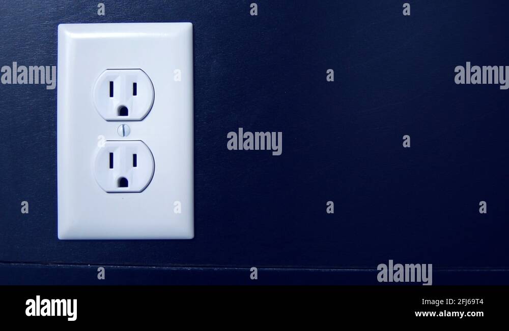 Light turns on and off at night as a cord is plugged into the bottom