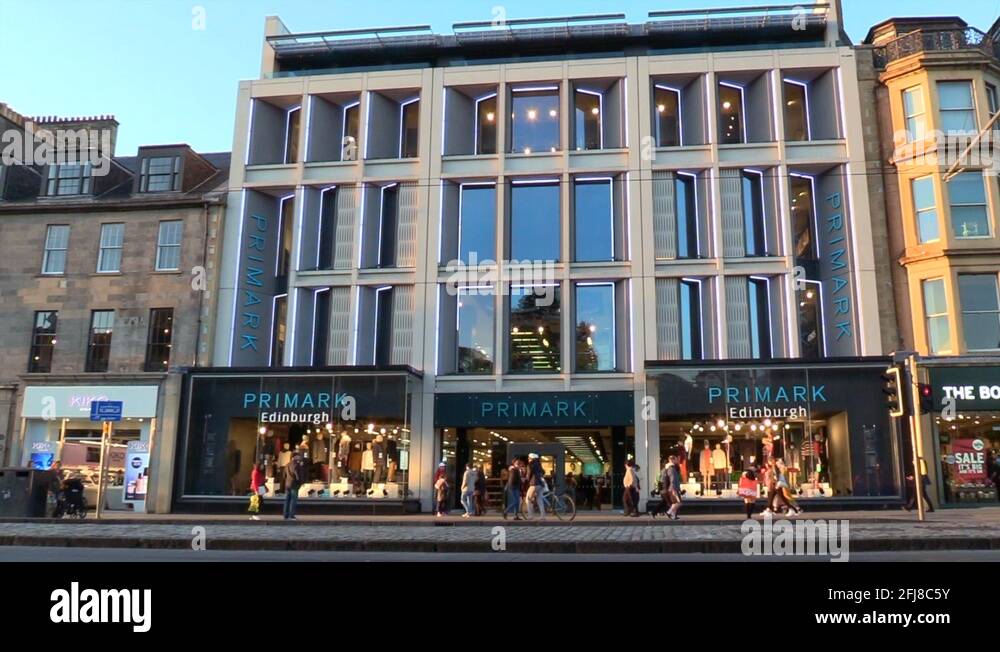 People Walking into Primark store, retail shop in Edinburgh Stock Video