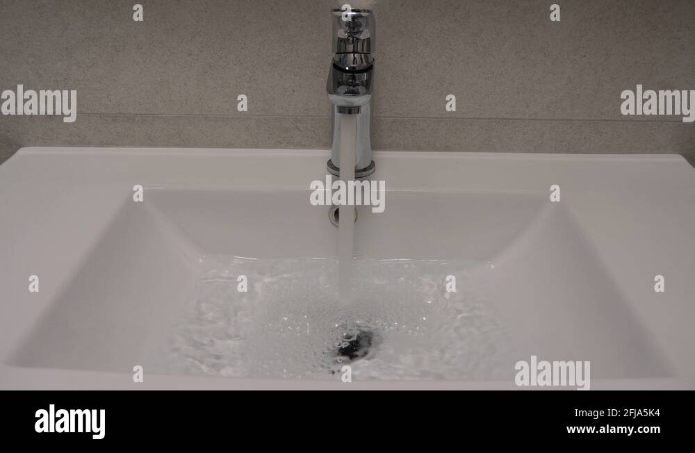 Water Flowing From Tap To Bathroom Sink Save Water Stock Video Footage