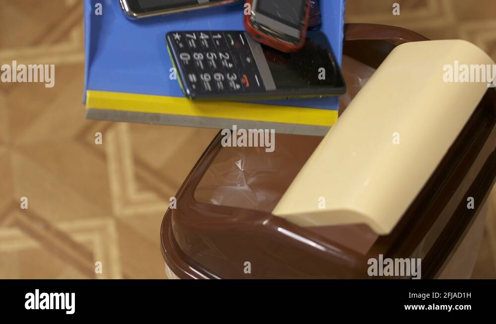 Old mobile phones recycling. Throwing obsolete cell phones in the trash