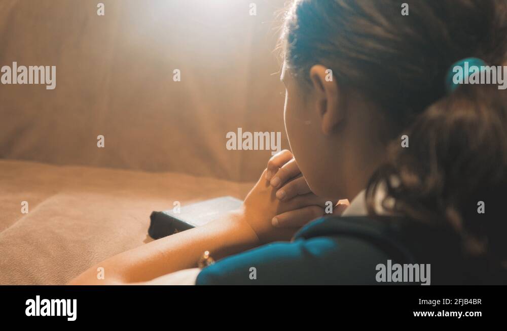 Little girl praying in the night. Little girl hand praying lifestyle