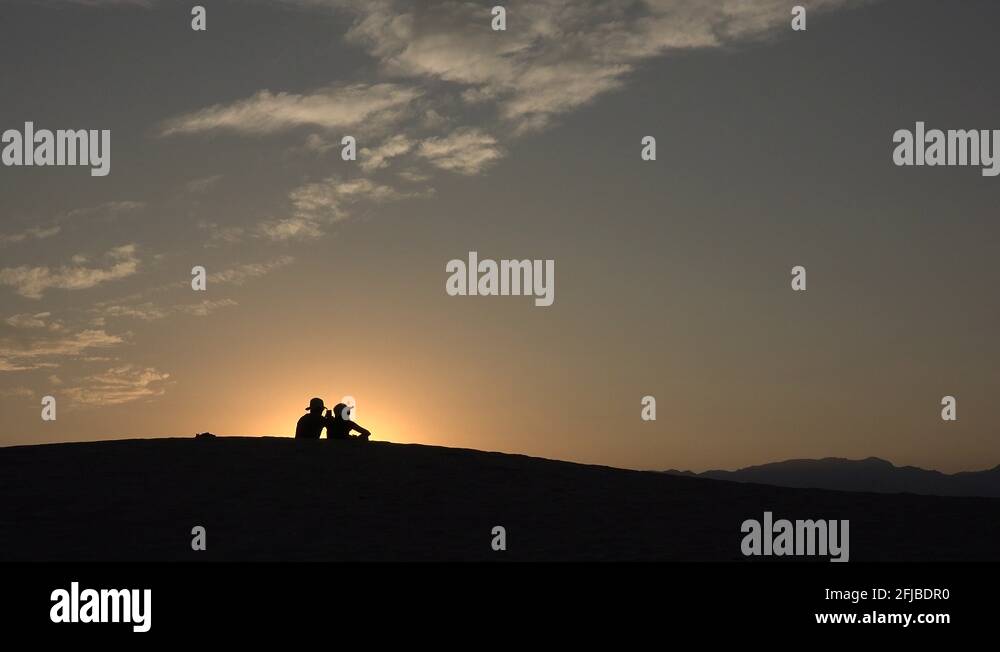 A couple at sunset, Mesquite Flat Sand Dunes, Death Valle, CA, USA ...