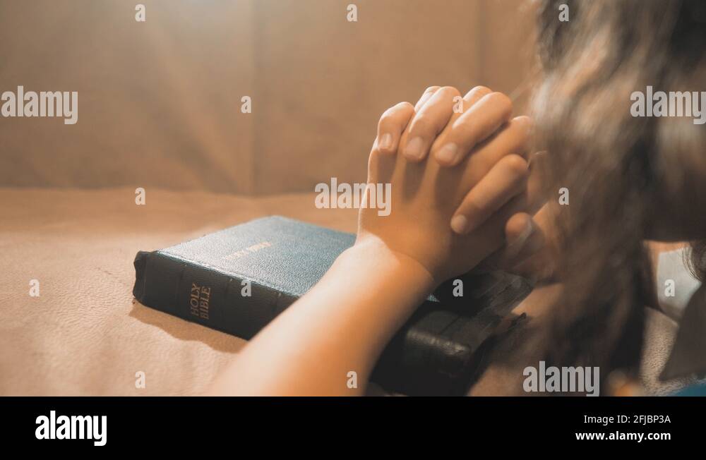 Little girl praying in the night. Little girl hand praying. little girl