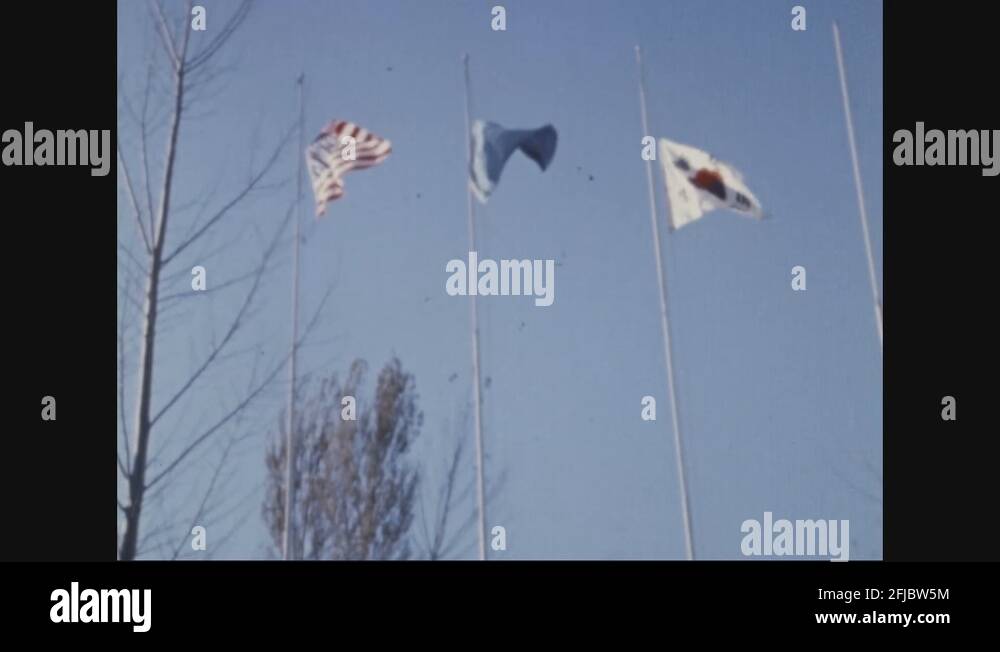 Korean soldiers lower flags and bugler plays bugle 1970 Stock Video