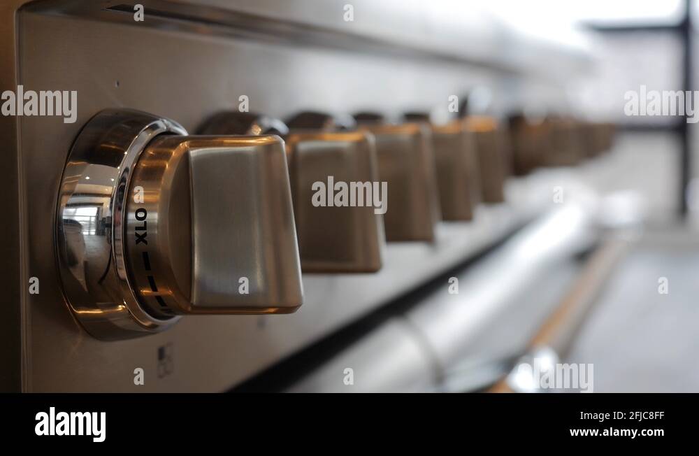 Close up of stove dials on highend stainless steel gas stove Stock