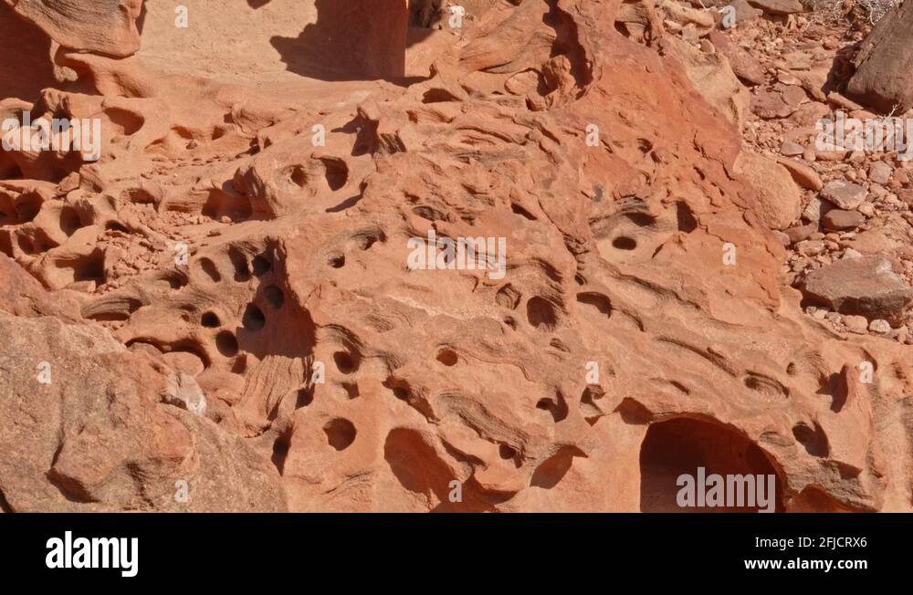 Tafoni rock formations in sandstone with small holes in Twyfelfontein