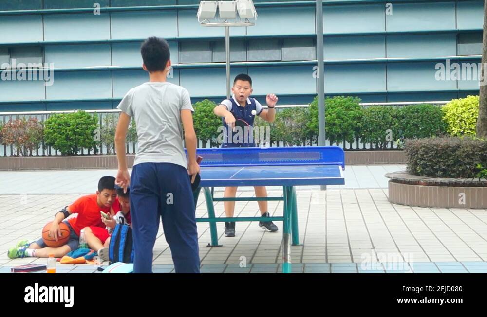 Shenzhen, China children play table tennis on weekends Stock Video