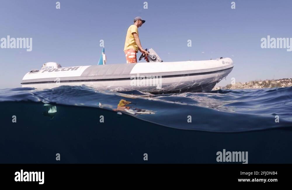 a boat accelerating with underwater view of the boat's propeller .mp4