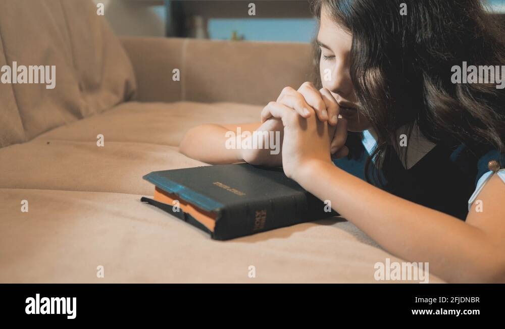 Little girl praying in the night. Little girl hand praying. little girl