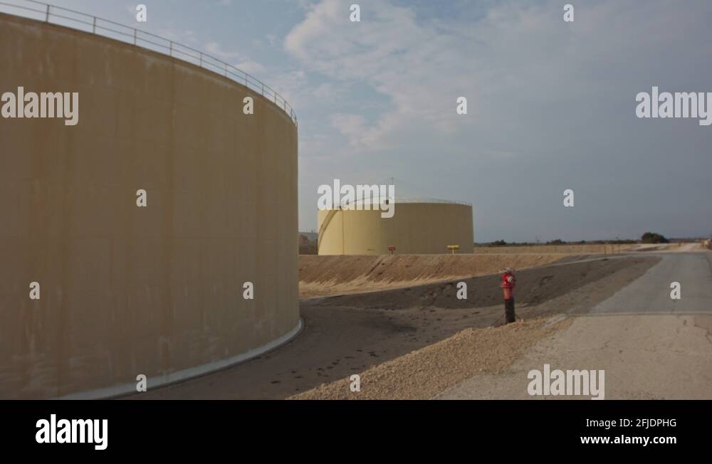 Large crude oil storage tanks in a huge refinery Stock Video Footage