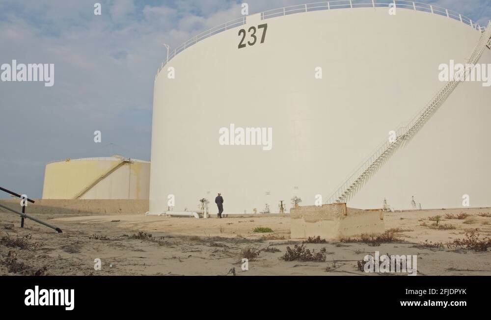Large crude oil storage tanks in a huge refinery Stock Video Footage
