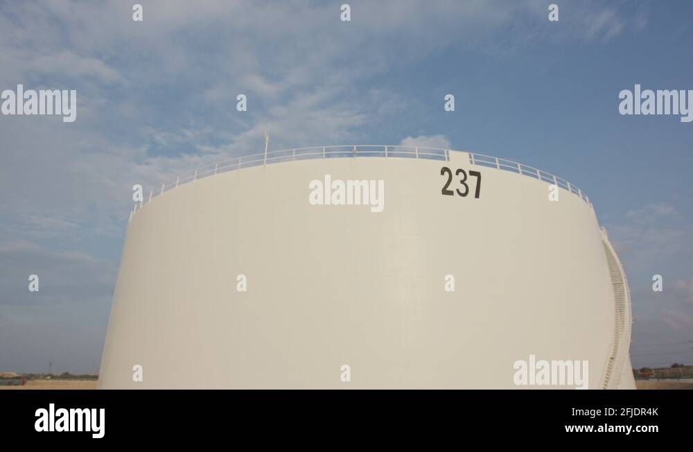 Large crude oil storage tanks in a huge refinery Stock Video Footage