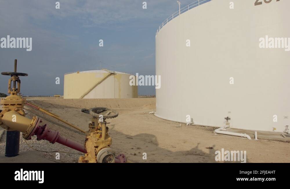 Large crude oil storage tanks in a huge refinery Stock Video Footage