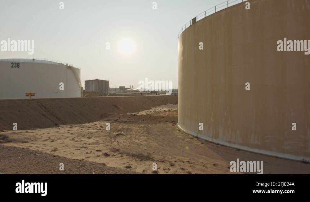 Large crude oil storage tanks in a huge refinery Stock Video Footage
