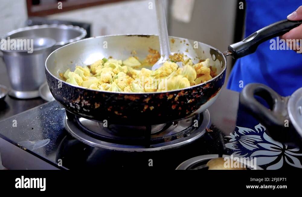 Indian woman cooking Stock Videos & Footage - HD and 4K Video Clips - Alamy