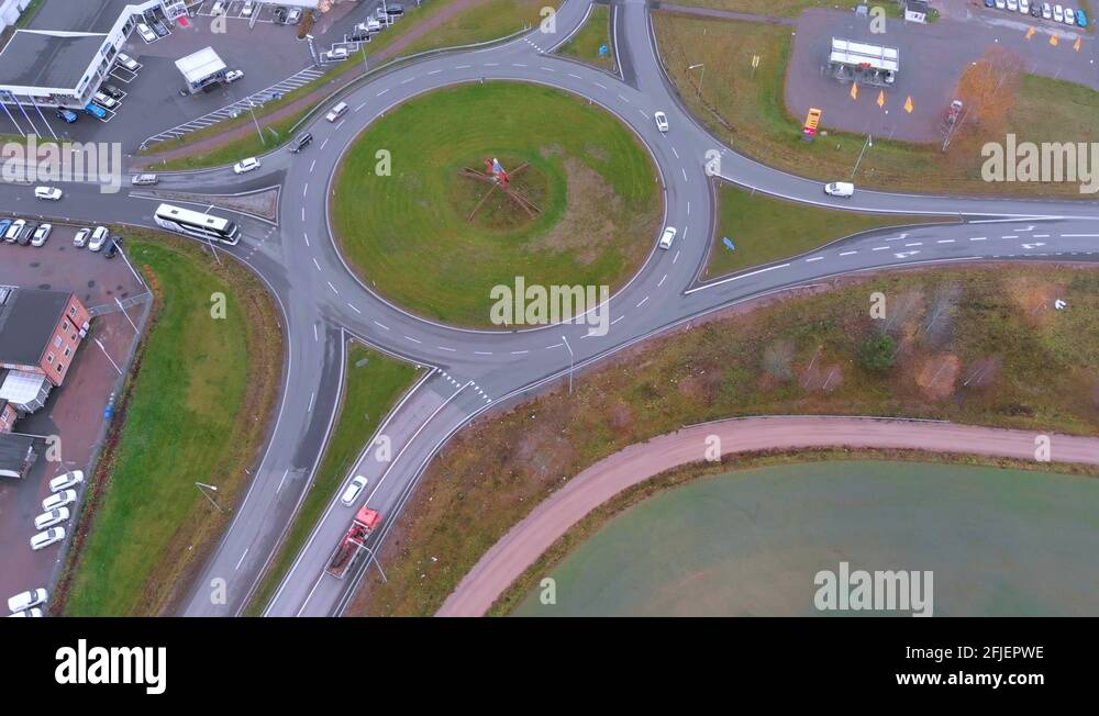 Rotating drone footage of a roundabout with with cars driving in and out Stock Video Footage Alamy
