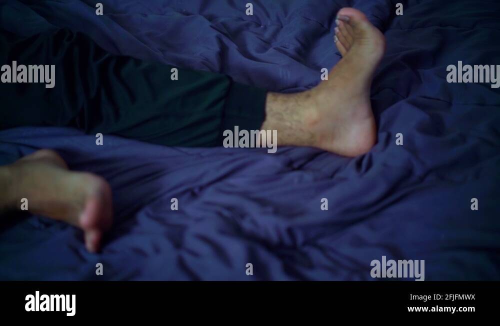 Man's legs on bed Stock Videos & Footage HD and 4K Video Clips Alamy