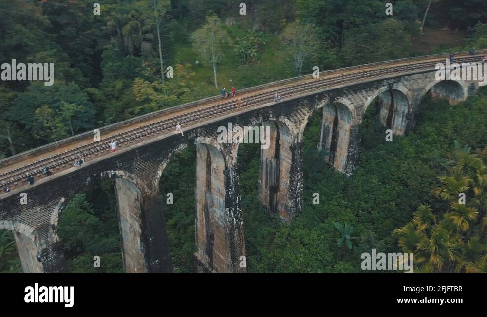 Drone aerial of famous Nine Arches Bridge Sri Lanka railway train with