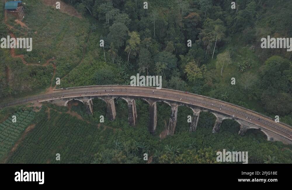 Drone aerial of famous Nine Arches Bridge Sri Lanka railway train with