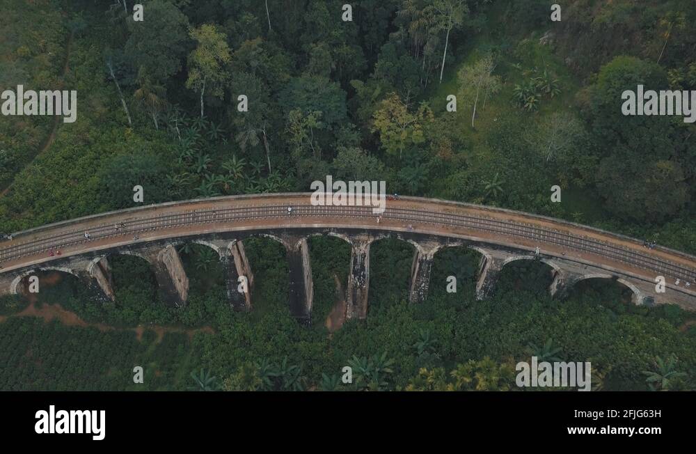 Drone aerial of famous Nine Arches Bridge Sri Lanka railway train with