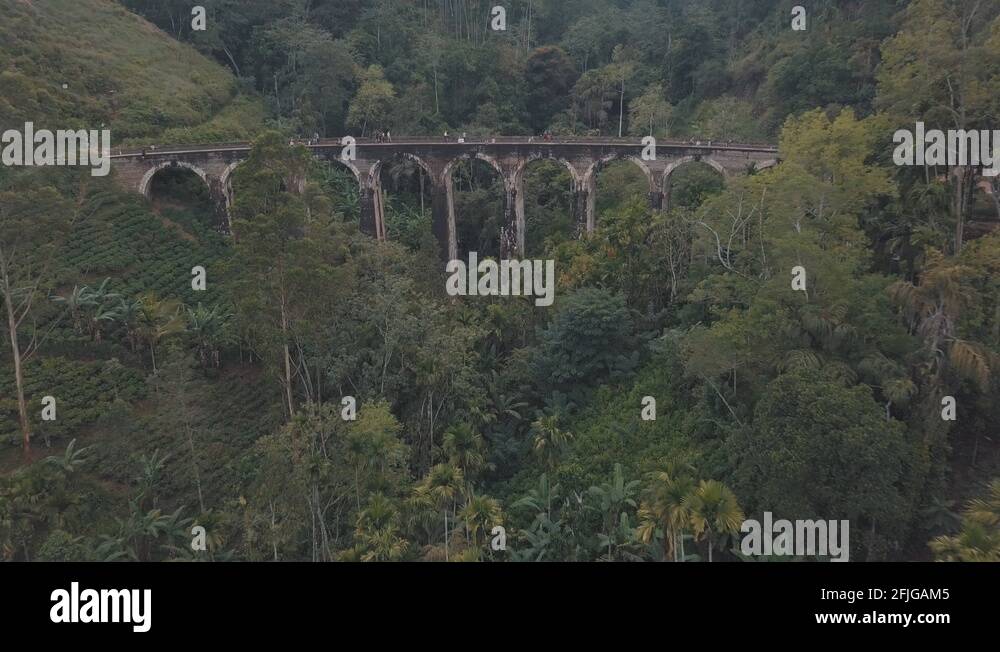 Drone aerial of famous Nine Arches Bridge Sri Lanka railway train with