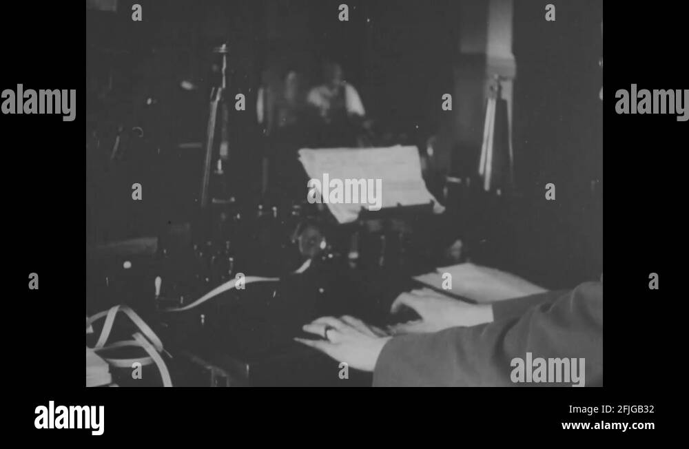 Scene of telegraph room and telegraphy operators on duty 1919 Stock