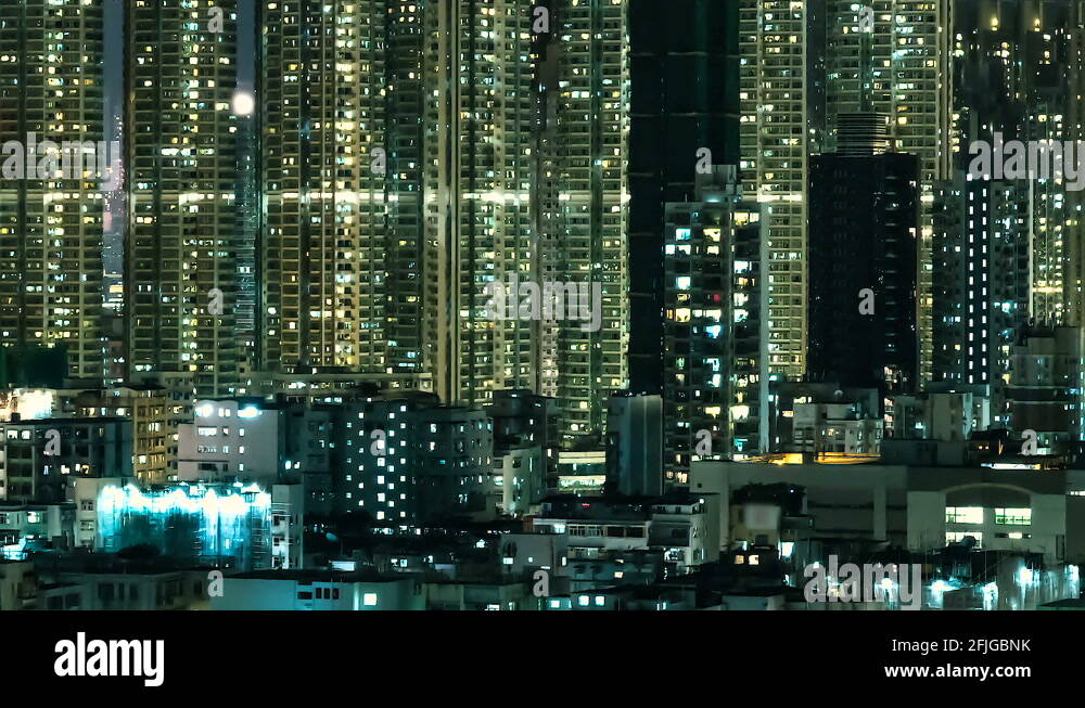 Very high density of apartment towers in of Hong Kong at night Stock