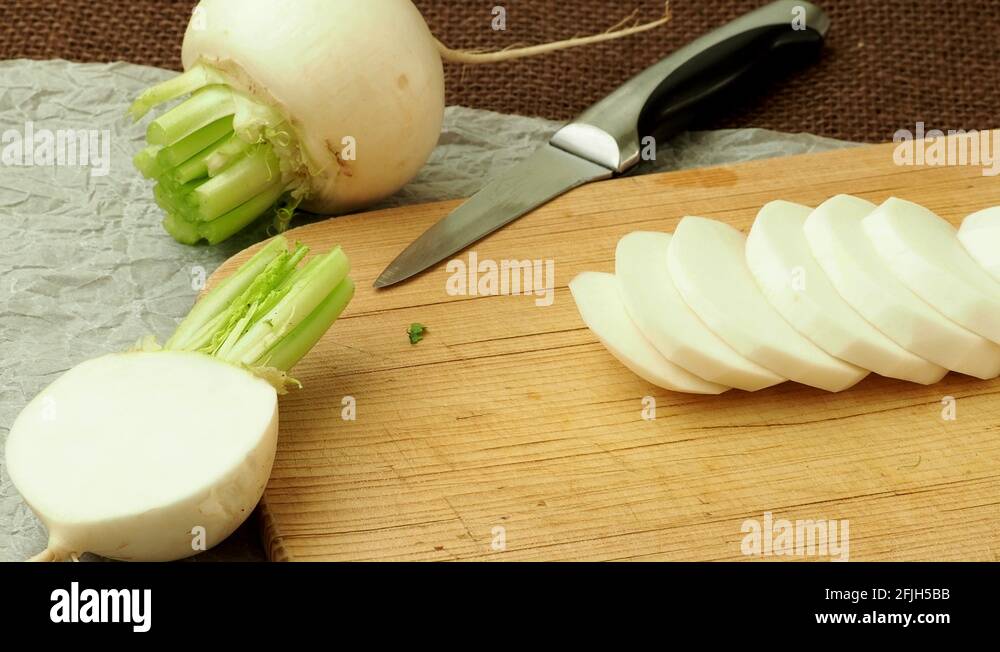 Japanese white fresh vegetable turnip root. Sliced daikon radish Stock