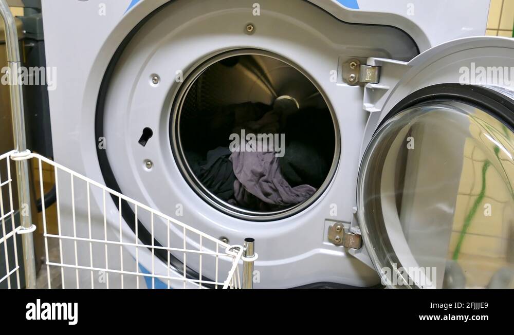 Man emptying washing machine laundry Stock Videos & Footage HD and 4K