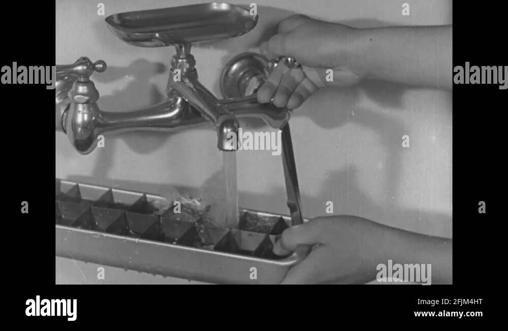 Girl keeps water in freeze and woman put oil lamp inside cupboard