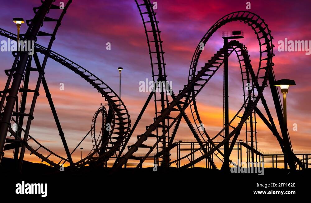roller coaster thrill ride at amusement park at sunset with car Stock Video  Footage - Alamy