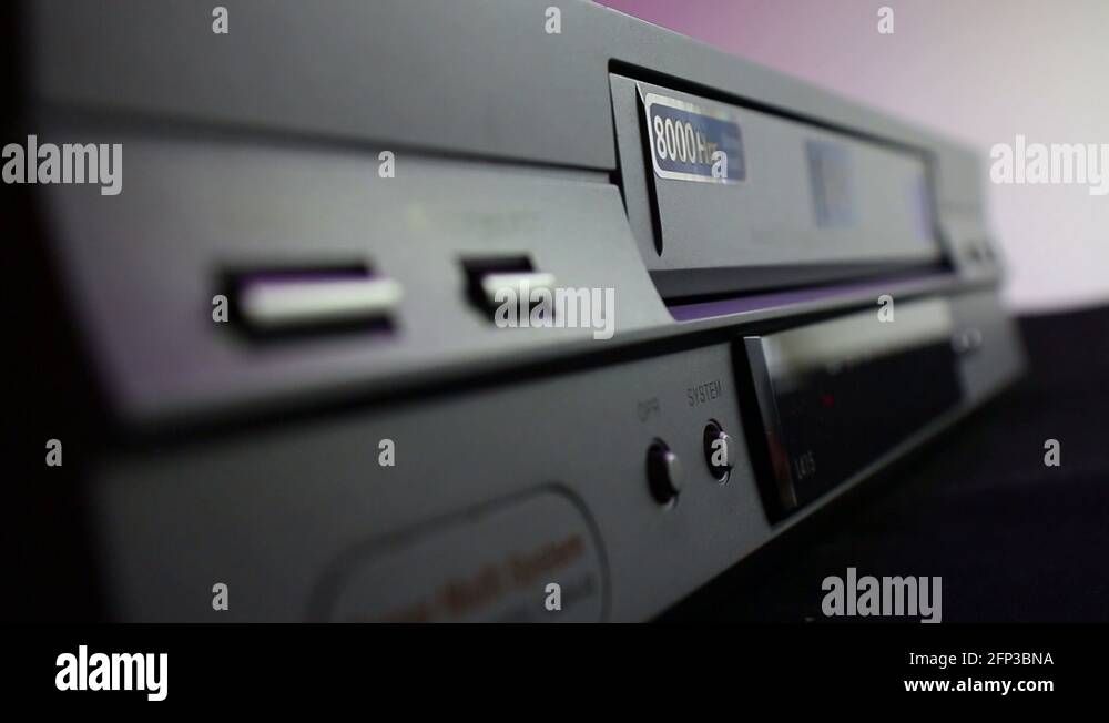 Inserting And Ejecting VHS Video Tape. Close Up Of A VCR Player Stock