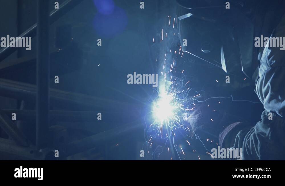 Welder working on a pipe structure, using MIG welding procedure Stock Video Footage Alamy