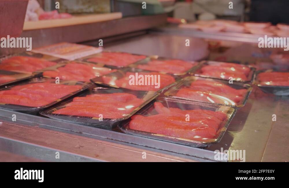 Panning Packets Of Fresh Tuna Fish Wrapped In Plastic At A Market Stall