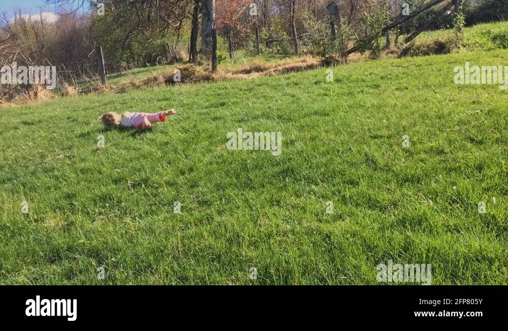 Girl rolling down hill Stock Videos & Footage - HD and 4K Video Clips