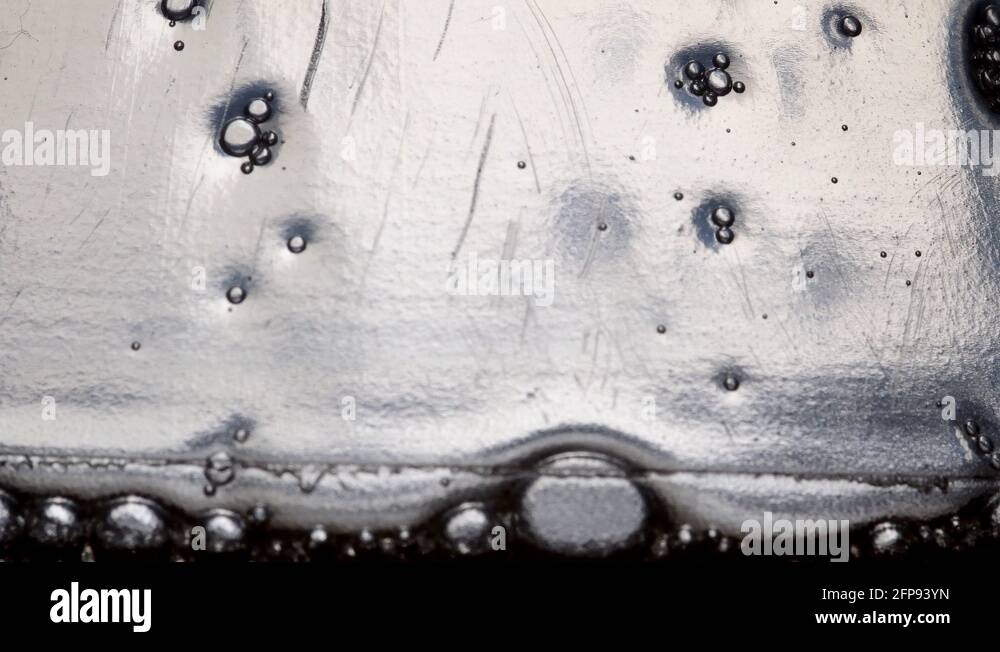 Some bubbles go down inside a detergent bottle Stock Video Footage Alamy