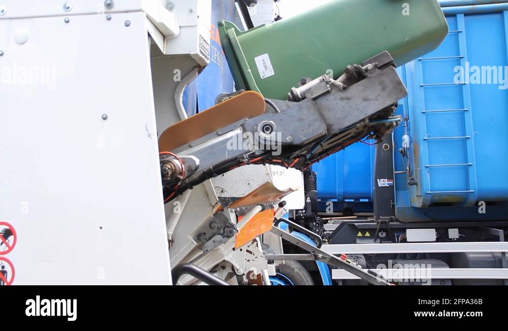 Garbage bin being emptied in garbage truck Stock Video Footage Alamy