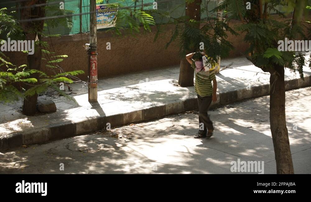 mancarryingabagonhisshoulder Stock Video Footage Alamy