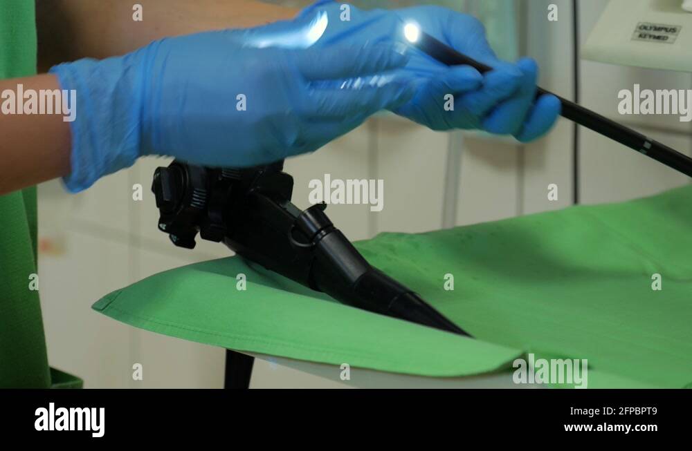 Doctor verifying flexible endoscope before medical examination. Close