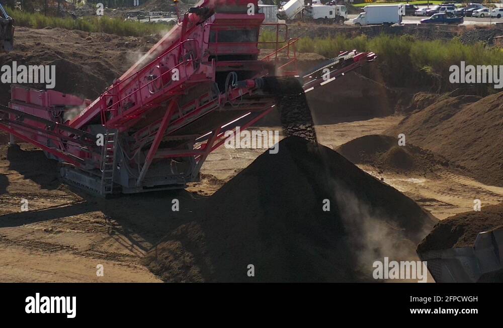 Push In to Large Conveyor Belt Sorting Soil into Large Pile on