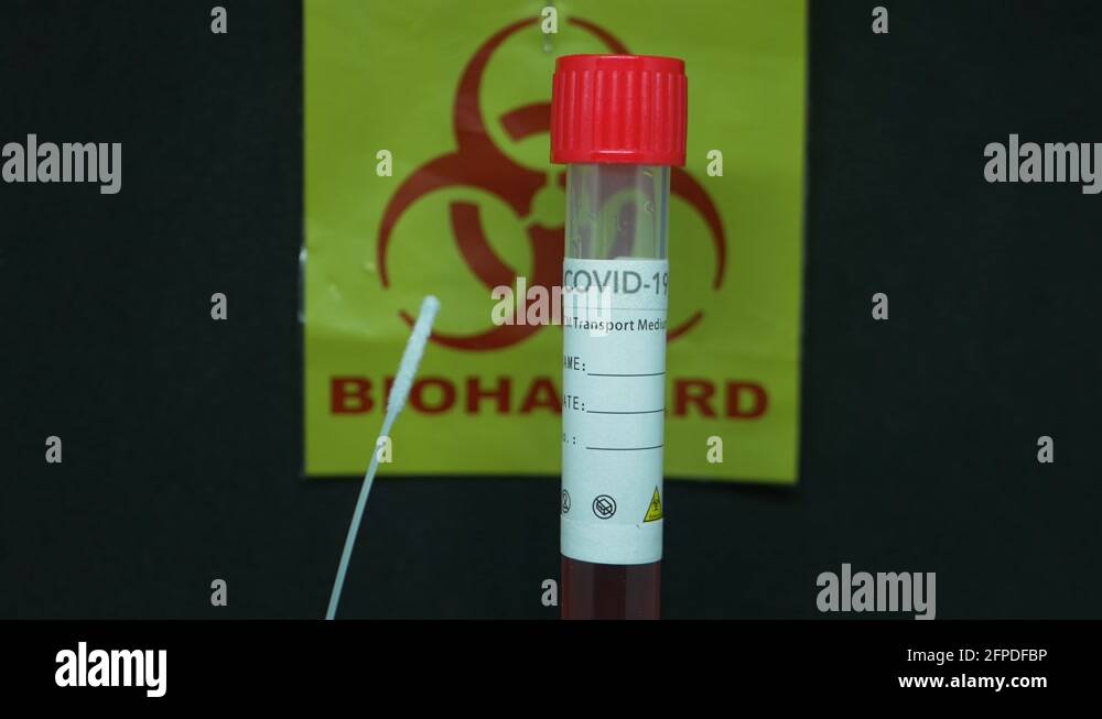 Covid19 Testing Kit Swab With Test Tube In Biohazard Background